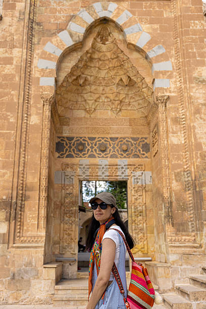istock A woman posing in front of a Mardin stone window 2214748008