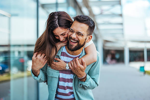 istock Smiling Couple Enjoying Quality Time Together Outdoors in Urban Setting 2214750261