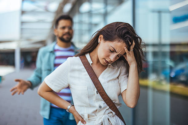 istock Couple Arguing Outdoors with Woman Feeling Frustrated and Man Gesturing 2214750855