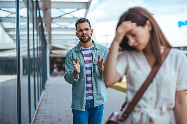 istock Frustrated Couple Arguing Outdoors on a Sunny Day 2214750856