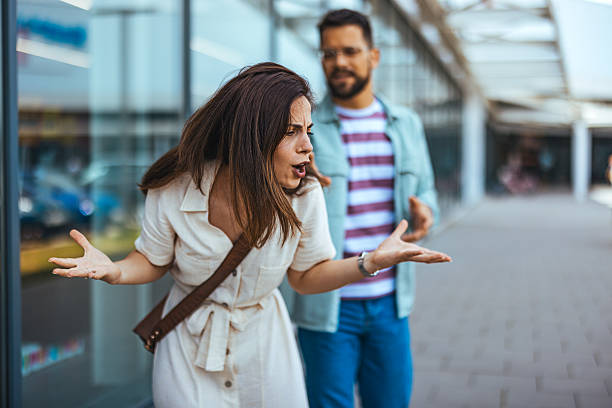 istock Couple Having an Argument in an Outdoor Urban Setting 2214750860