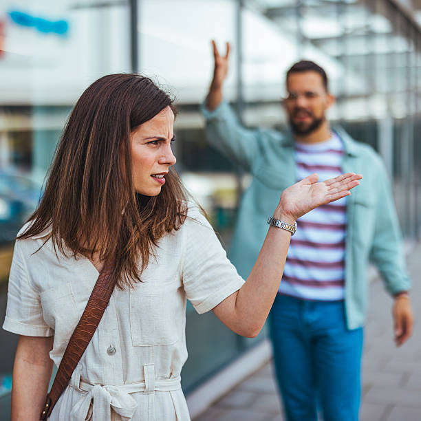 istock Woman Annoyed While Being Confronted by Man in Urban Setting 2214750868