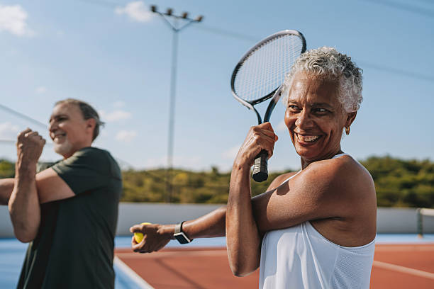 istock Senior people stretching to play tennis 2214754618