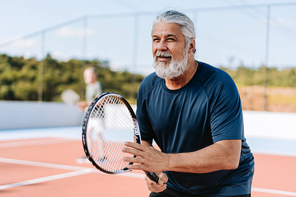 istock Ratrato senior men playing tennis 2214754777