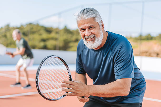 istock Ratrato senior men playing tennis 2214754857