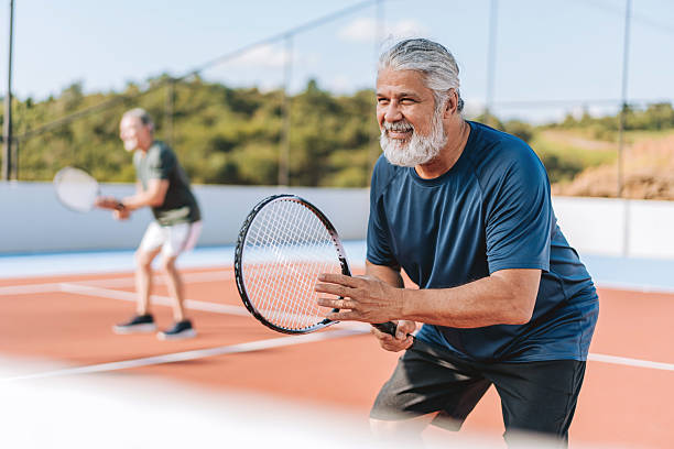 istock Ratrato senior men playing tennis 2214754858