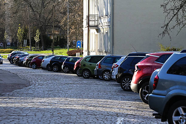 istock Parked cars along the old stone covered road 2214756092