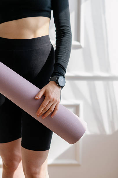 istock Home fitness routine with yoga mat for effective workout sessions 2214757278