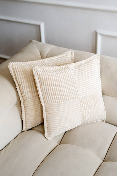 istock Elegant white couch adorned with comfortable cushions in modern interior design 2214757307