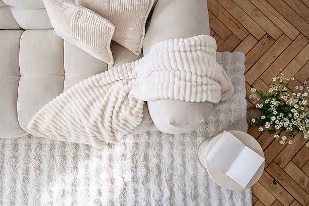 istock Cozy white interior with a modern couch and stylish decor 2214757315