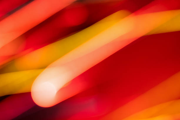 Abstract background made of motion blurred light trails in red tones. Dynamic image.