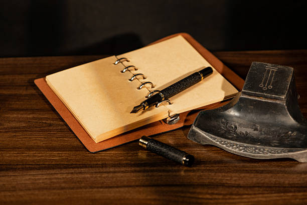istock Fountain pen, beautiful fountain pen in an old environment with a black background, selective focus. 2214759521