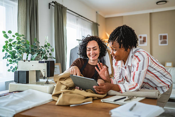 istock two multicultural women work together on new product at tailor studio 2214760152