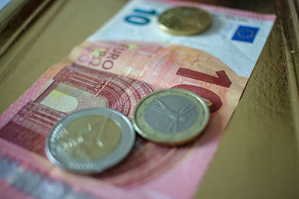istock coins and a ten euro bank note 2214760965