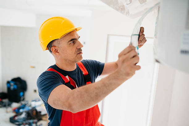 istock Caucasian worker installs air conditioner 2214763178