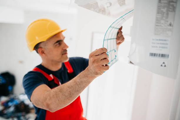 istock Caucasian worker installs air conditioner 2214763209