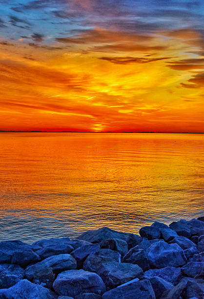 istock Sun rising over rock abutment, Chesapeake Bay 2214764013