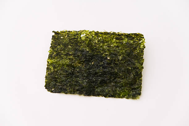 istock nori seaweed sheet isolated on white, 2214764029