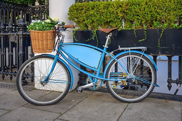 istock Vintage Blue Bicycle with Flower Basket 2214764335