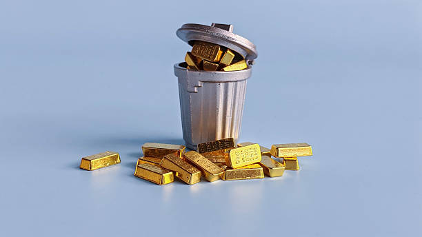 istock Overturned Trash Can Filled with Gold Bars Representing Misplaced Value, Wealth Waste, and Irony of Worth 2214767518