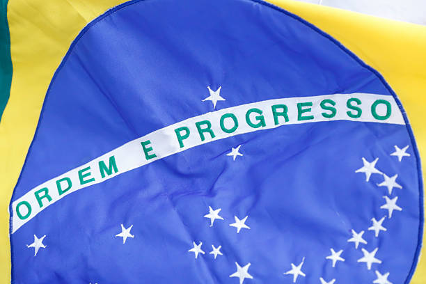 istock Brazilian flag fluttering from a flag pole - Brazil 2214770376