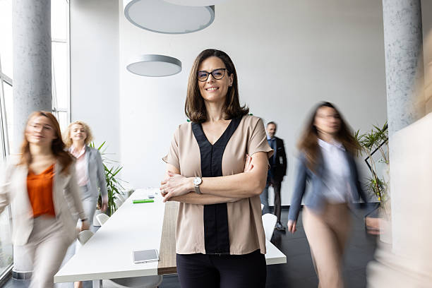 istock Smiling businesswoman standing confidently in office space 2214771408