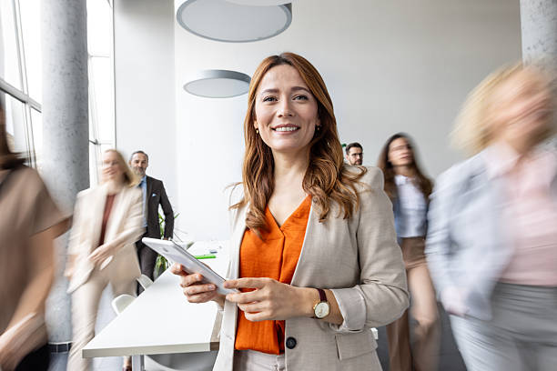 istock Joyful Businesswoman in Modern Office Setting 2214771415