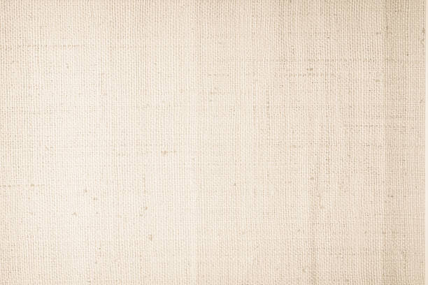 istock Brown sackcloth woven texture background in natural pattern. Jute hessian burlap, linen background in light beige cream color blank. Weaving canvas fiber line cotton cloth textured as organic. 2214771540