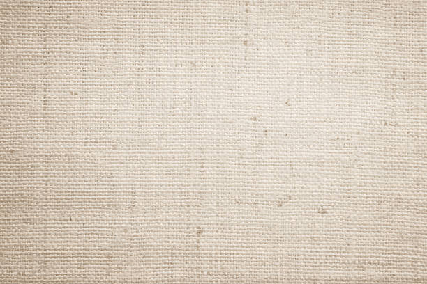 istock Brown sackcloth woven texture background in natural pattern. Jute hessian burlap, linen background in light beige cream color blank. Weaving canvas fiber line cotton cloth textured as organic. 2214771550