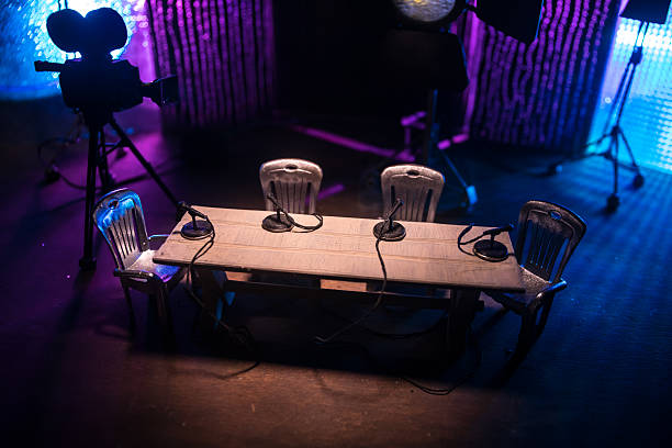 istock Podcast Studio Setup with Four Microphones and Cameras Ready for Recording 2214772451