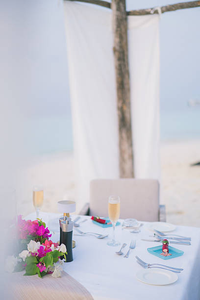 istock Sparkling wine on table at restaurant on edge of sea 2214776764