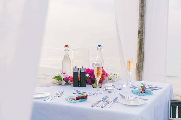 istock Sparkling wine on table at restaurant on edge of sea 2214776770