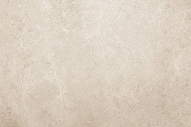 istock Colour old concrete wall texture background. Close up retro plain cream color cement wall background texture. Design paper vintage parchment element. 2214778549