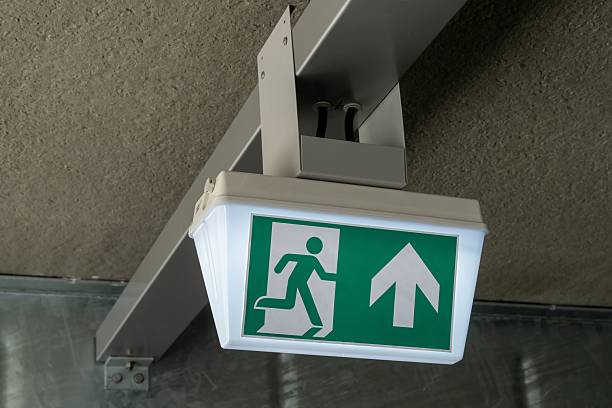 istock Emergency exit sign showing safe egress route in building 2214779046