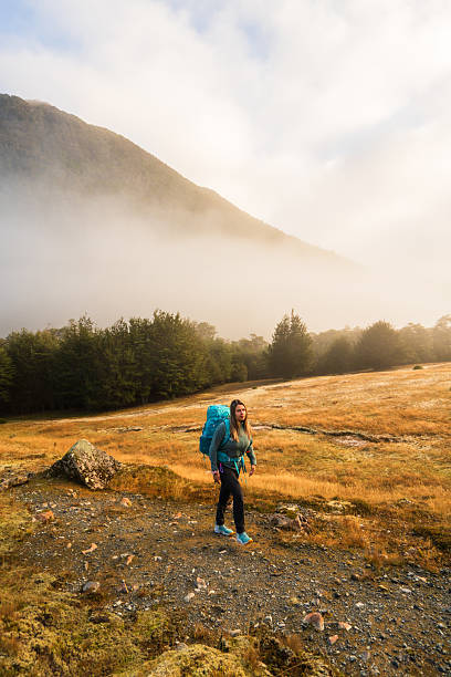 istock Female hiker trekking on hiking trail. 2214787441
