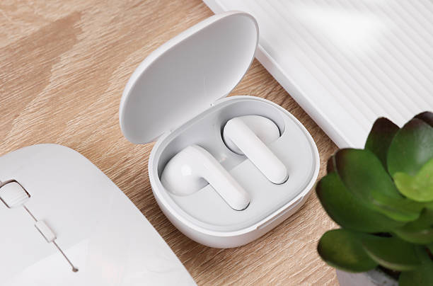 istock Modern gadgets. Wireless earphones, PC mouse and power bank on the table. Flat lay 2214787444