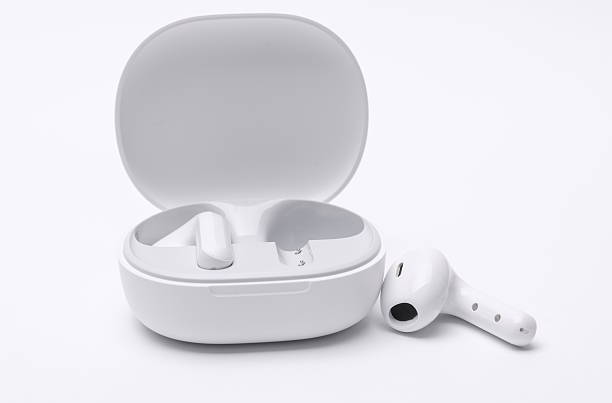 istock White Wireless earphones with charging case isolated on white background 2214787478