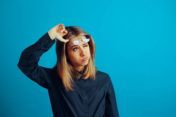 istock Woman Taking off Her Eyeglasses Making an Expression 2214788764