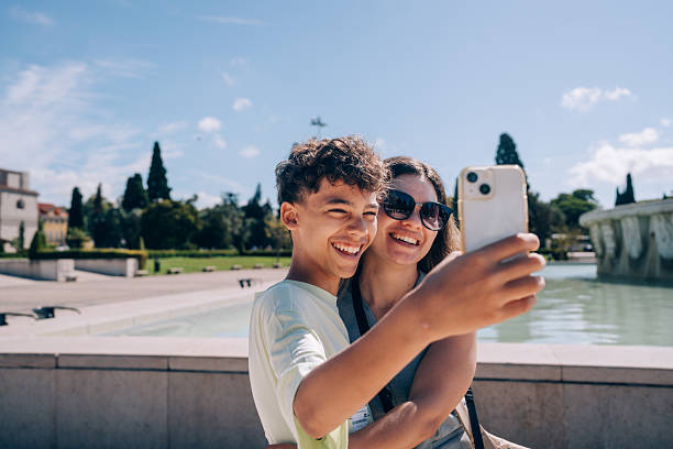 Woman taking a selfie in front of Mosteiro dos Jeronimos