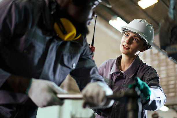 istock A technicians team working together in factory. A workers inspecting machines 2214790582
