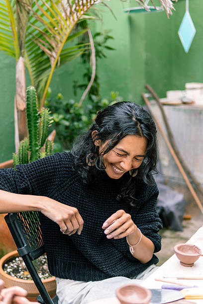 istock Artisan working with clay is smiling in her workshop 2214791809
