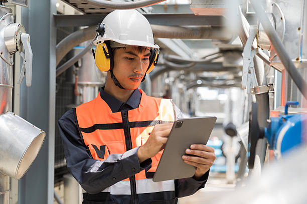 istock Utilities, Building utilities. Network of utilities on rooftop of building. Engineer worker inspecting quality of utilities system in sewer pipes area at rooftop of building area 2214793674