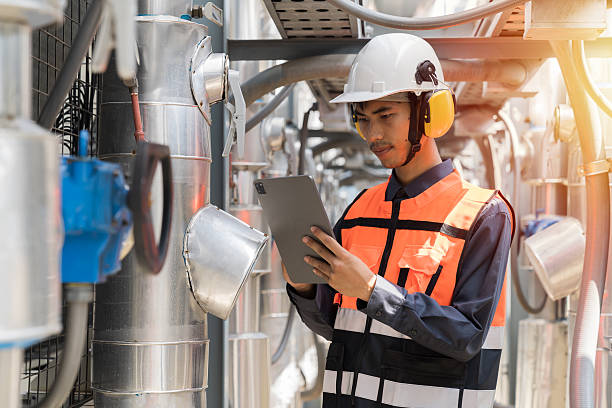 istock Utilities, Building utilities. Network of utilities on rooftop of building. Engineer worker inspecting quality of utilities system in sewer pipes area at rooftop of building area 2214793680