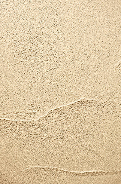 istock Front View of Light Beige Colored Grunge Concrete Wall 2214793977
