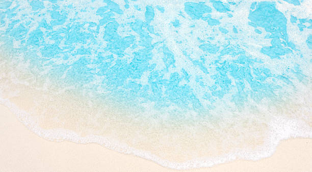 istock beautifully wave on  sand beach, closeup, top view 2214797424