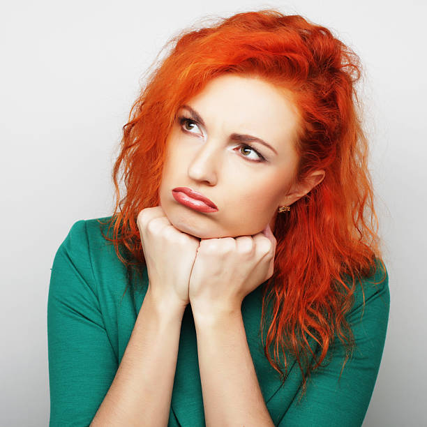 istock Thinking woman pondering over something 2214798350