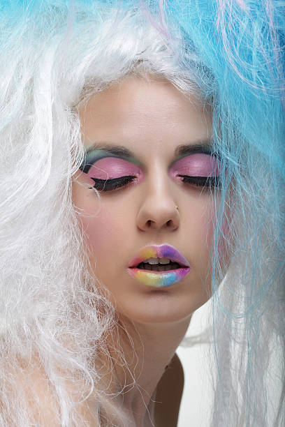 istock young woman with bright make up and creative hair 2214798415