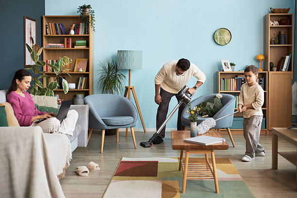 istock Family Doing Housework At Home 2214800448