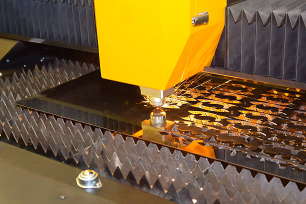 istock CNC laser cutting machine cutting metal with sparks 2214800620