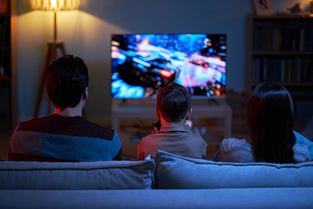 istock Child Playing Video Game With Parents 2214800809